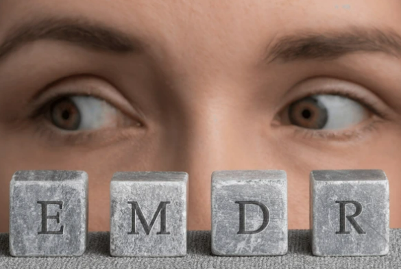 Person’s eyes shifting focus while looking at EMDR letter blocks, representing the eye movement process in EMDR trauma therapy.